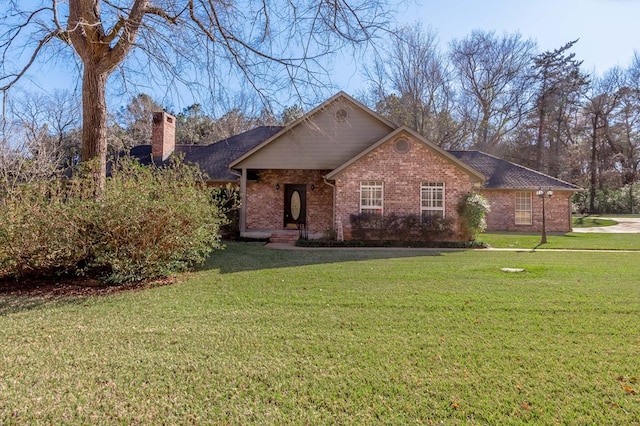 single story home with a front lawn