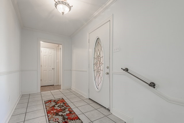 tiled foyer featuring crown molding