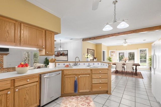 kitchen featuring a wealth of natural light, dishwasher, french doors, and sink