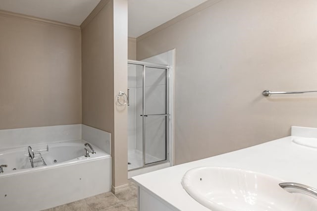 bathroom featuring tile patterned floors, vanity, shower with separate bathtub, and ornamental molding