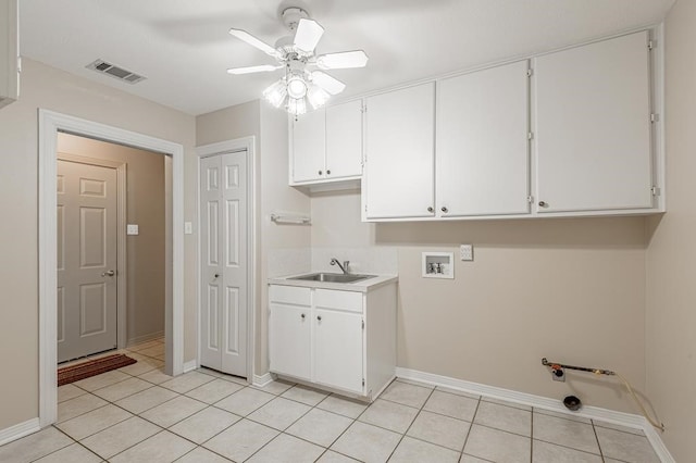 laundry area featuring cabinets, sink, washer hookup, ceiling fan, and light tile patterned flooring