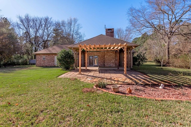 back of house featuring a pergola, a yard, and a patio