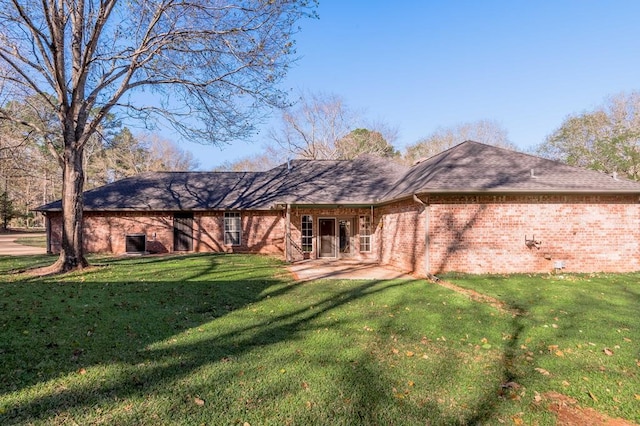 back of house featuring a yard and a patio