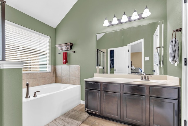 bathroom featuring separate shower and tub, tile patterned flooring, vanity, and lofted ceiling