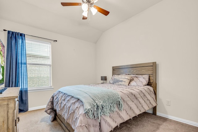 carpeted bedroom with vaulted ceiling and ceiling fan