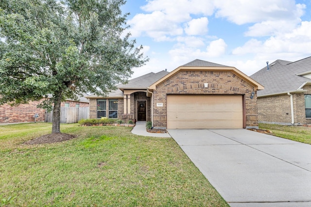 view of front of home featuring a garage and a front yard