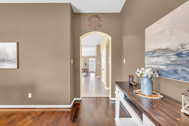 hall with dark wood-type flooring