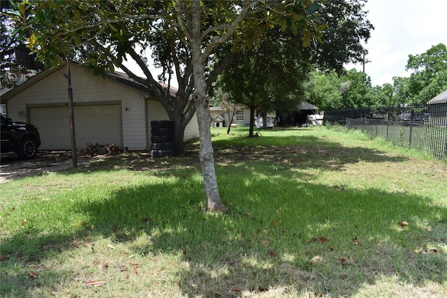 view of yard with an outbuilding and a garage