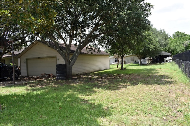 view of yard featuring a garage