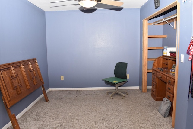 interior space with light carpet, a closet, and ceiling fan