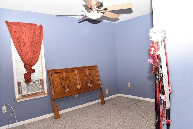 bedroom featuring light colored carpet, ceiling fan, and cooling unit