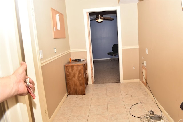 hall with light tile patterned floors