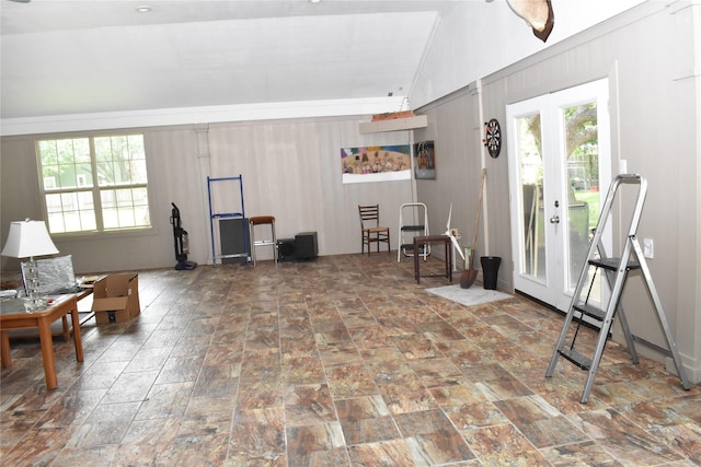 sitting room with a wealth of natural light and vaulted ceiling