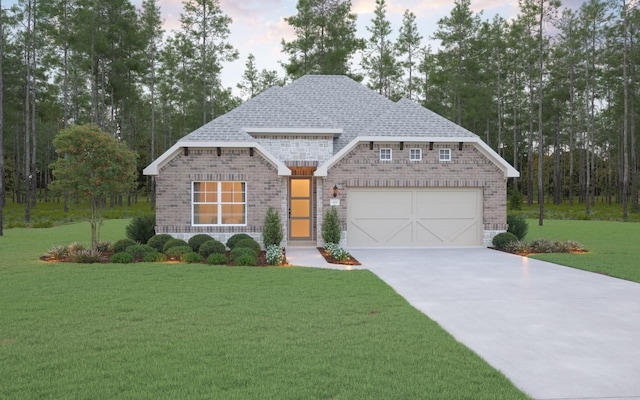 view of front of house with a front lawn and a garage