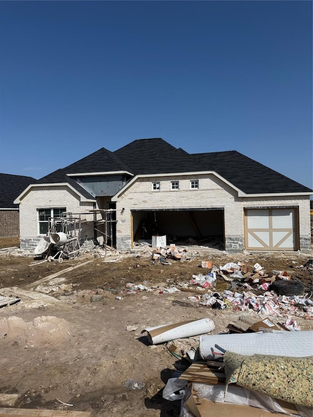 property in mid-construction with a garage