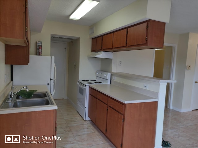 kitchen with white appliances and sink