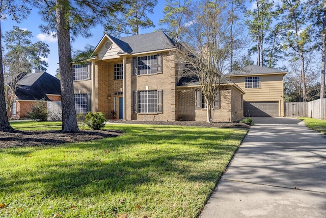 view of front of house with a front lawn and a garage