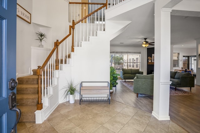 tiled entrance foyer featuring ceiling fan