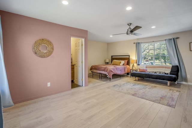 bedroom with ceiling fan and light hardwood / wood-style flooring