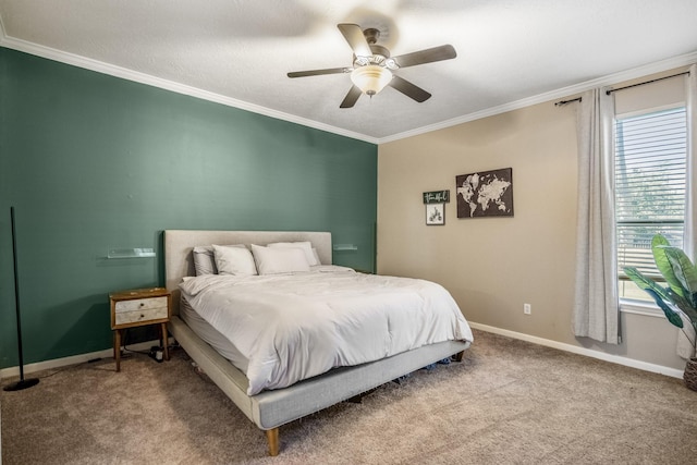 carpeted bedroom with ceiling fan and crown molding