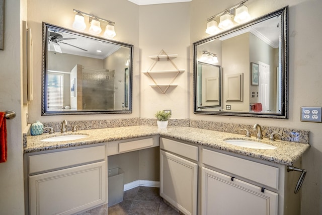 bathroom featuring ceiling fan, tile patterned floors, an enclosed shower, vanity, and ornamental molding