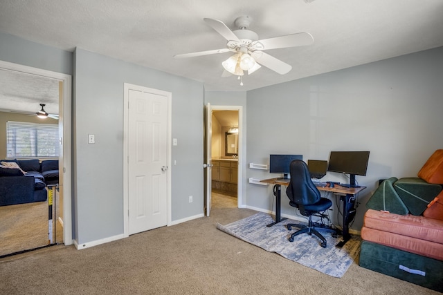 carpeted home office with ceiling fan