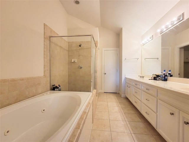 bathroom featuring tile patterned flooring, vanity, plus walk in shower, and vaulted ceiling