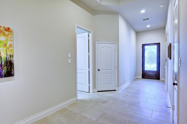 corridor with light tile patterned floors