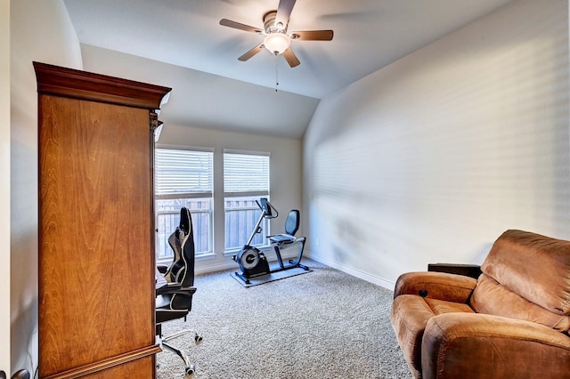 carpeted office space with ceiling fan and lofted ceiling