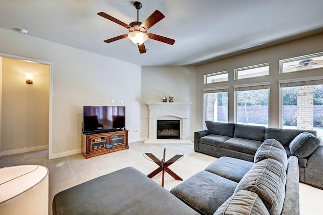 living room with ceiling fan and light tile patterned floors