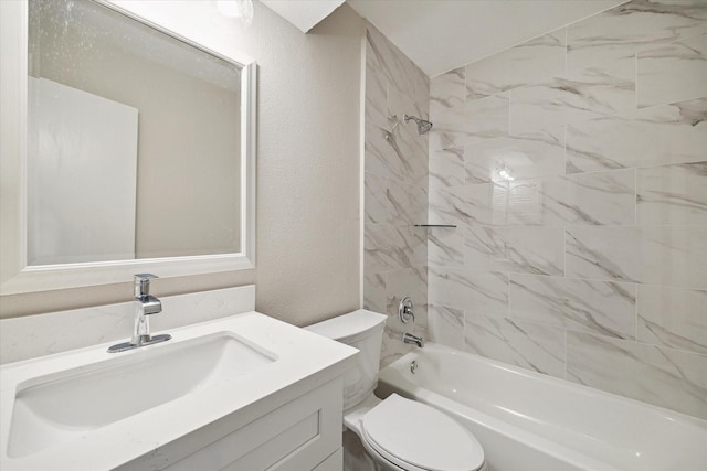 full bathroom featuring vanity, toilet, and tiled shower / bath