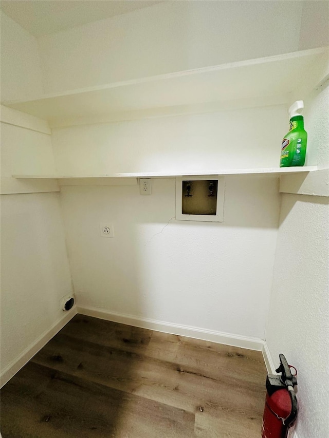 washroom featuring washer hookup, dark wood-type flooring, and hookup for an electric dryer