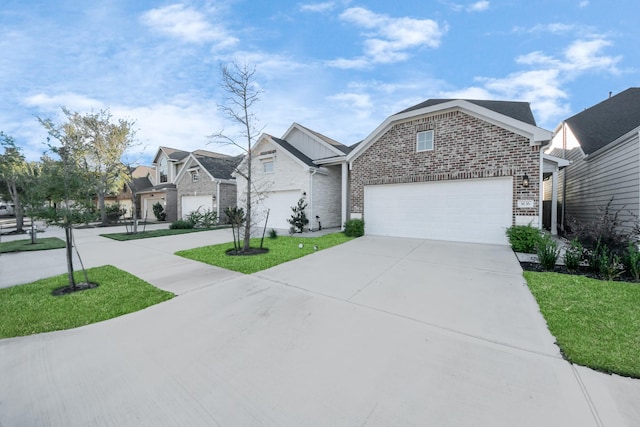 view of front of home featuring a garage and a front yard