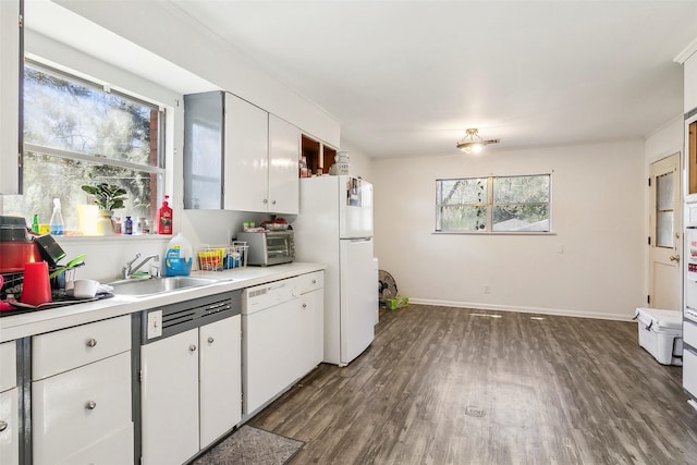 kitchen with white appliances, dark hardwood / wood-style floors, white cabinetry, and sink