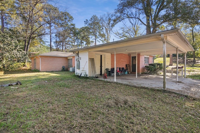 rear view of property featuring a yard