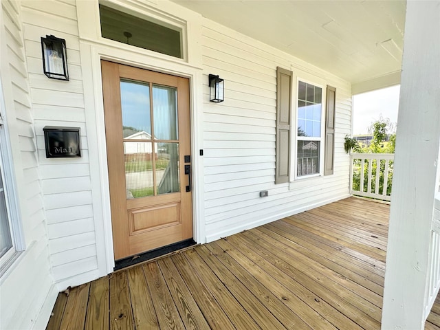 property entrance featuring covered porch