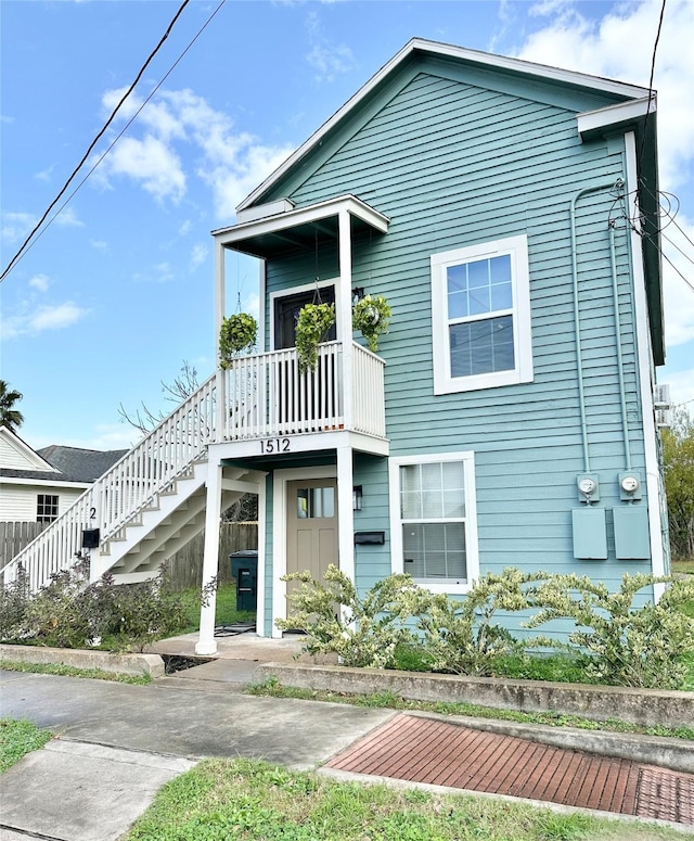 view of front of property featuring stairway