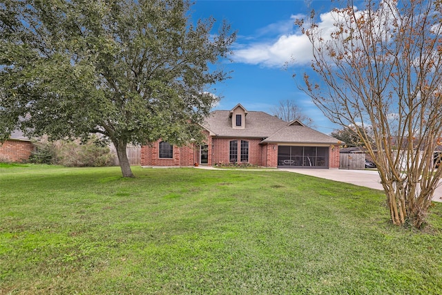 view of front of property with a sunroom and a front yard