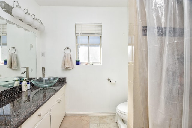 bathroom with tile patterned flooring, vanity, toilet, and a shower with shower curtain