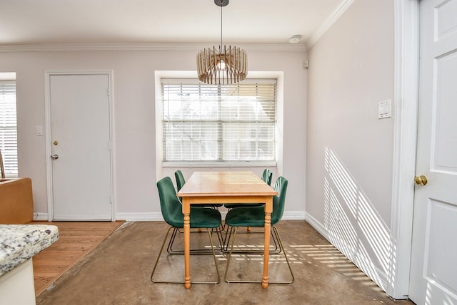 dining area featuring crown molding, wood-type flooring, and an inviting chandelier