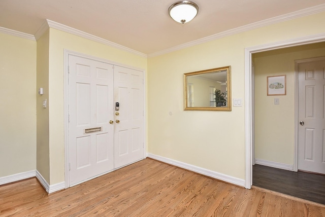 entrance foyer with light wood-type flooring and crown molding