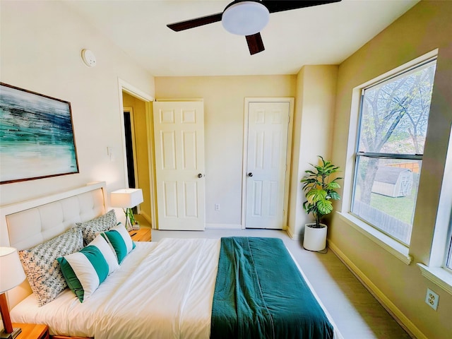 bedroom featuring light hardwood / wood-style flooring and ceiling fan