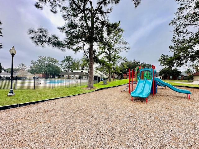 view of playground with a yard