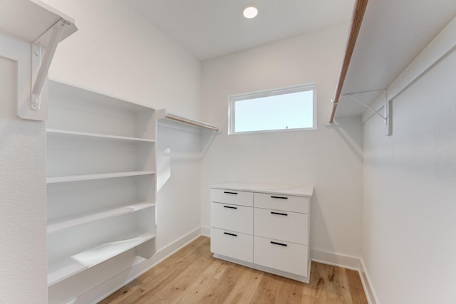 walk in closet featuring light hardwood / wood-style flooring