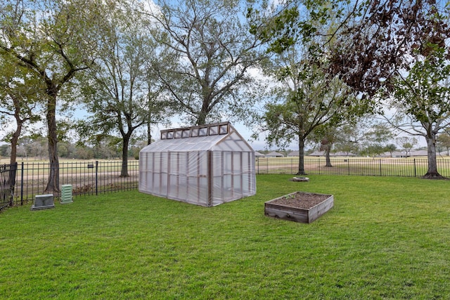 view of yard with a rural view and an outdoor structure