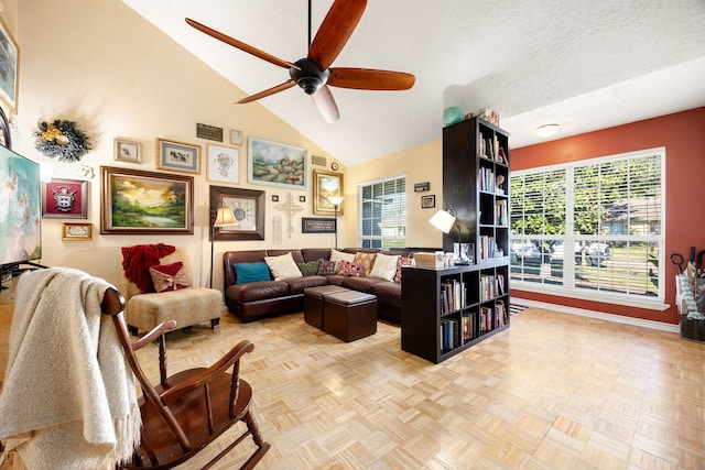 living room featuring ceiling fan, a textured ceiling, high vaulted ceiling, and light parquet flooring