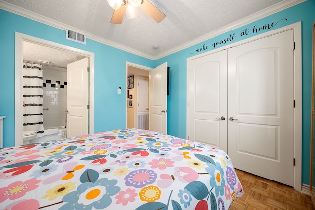 bedroom with a closet, crown molding, ceiling fan, a textured ceiling, and light parquet flooring