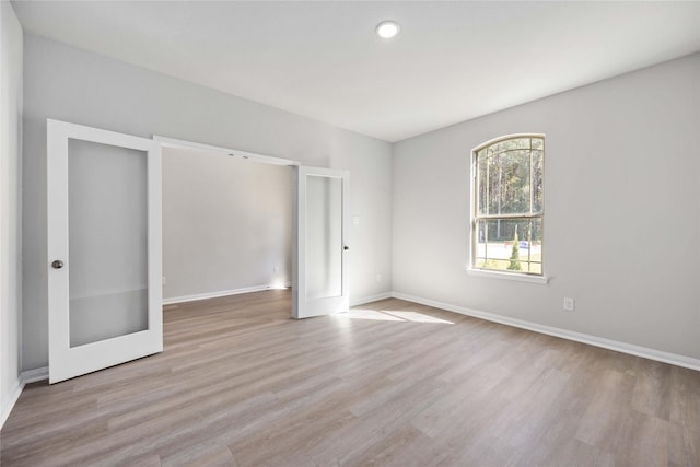 unfurnished bedroom featuring light hardwood / wood-style floors