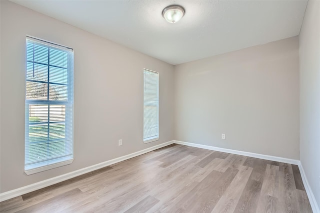 unfurnished room featuring light hardwood / wood-style floors