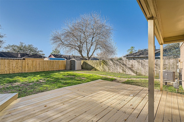 deck featuring a yard and a shed